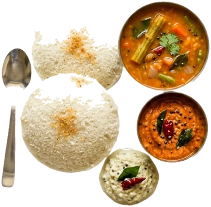 Two idli with sambar, coconut chutney and tomato chutney