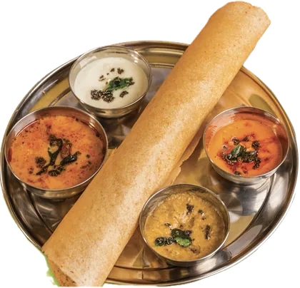 A masala dosa on a thali, rolled, with four chutneys and sambar around it